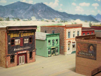 Great old west town.  Buildings made using the layering method.  Cut out windows and doors on one copy and put a second uncut copy behind  see  click for pictures of this town all made with Model Builder