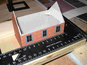 start of a cottage, the customer's first Model Builder project. Note the use of the square for construction, and corner bracing inside the model