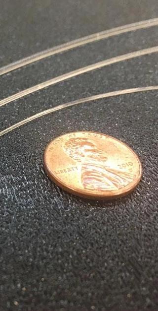 Fiber optic strands compare to coin size